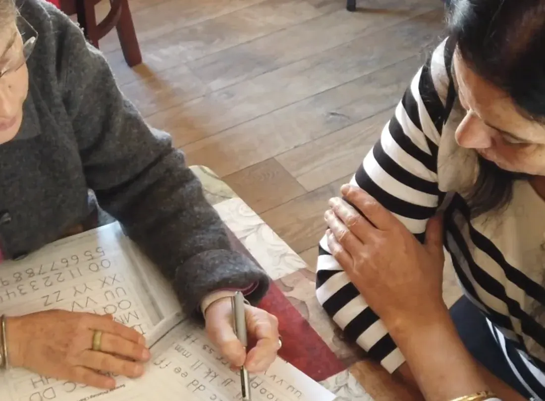 About Us image - PLACEHOLDER (replace with a real ULA photo) Placeholder photo: a literacy tutor and a student working together at a table.